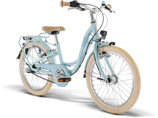 PUKY Skyride Classic är en ljusblå juniorcykel med genomstegsram designad för 6-åringar. Den har beige styre och sadel, ett bakre lastställ, LED-lyset fram- och bakljus som drivs av en dynamolampa, ljusbruna däck och ett kedjeskydd. 20-tumscykeln med tre växlar är avbildad i en tre fjärdedels vinkel mot en vanlig bakgrund.